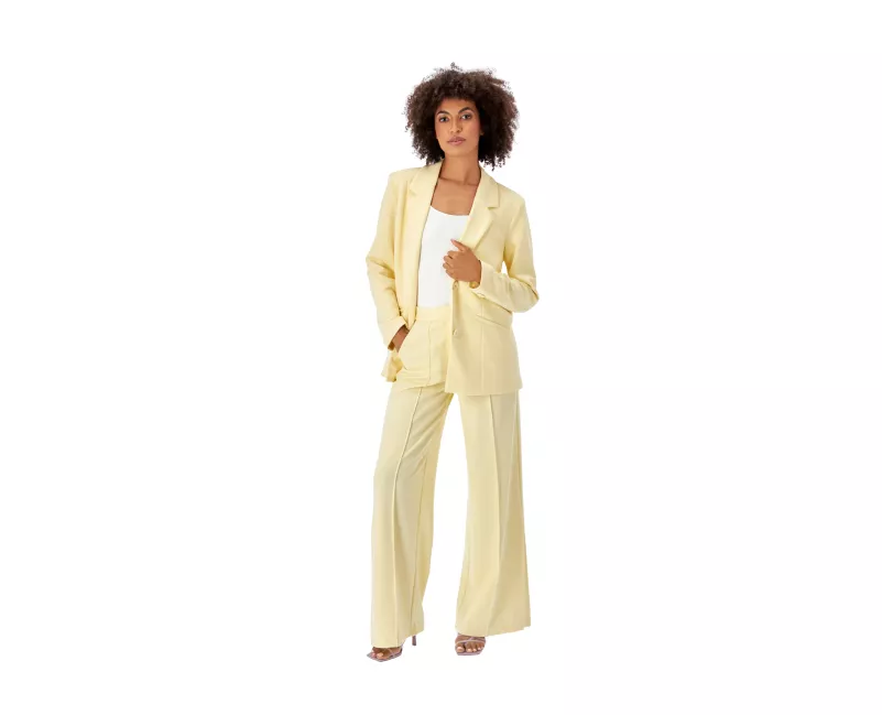 Woman in a cream suit in live model fashion photography