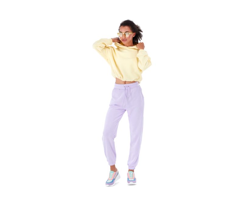 Woman in Pastel Yellow Hoodie and Lilac Joggers