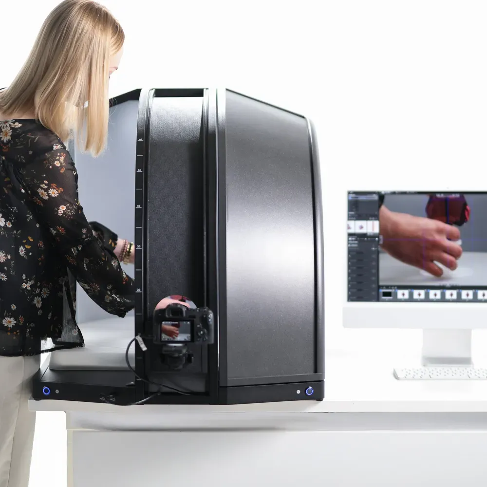 Woman Placing Product in Automated 360 Photography Studio