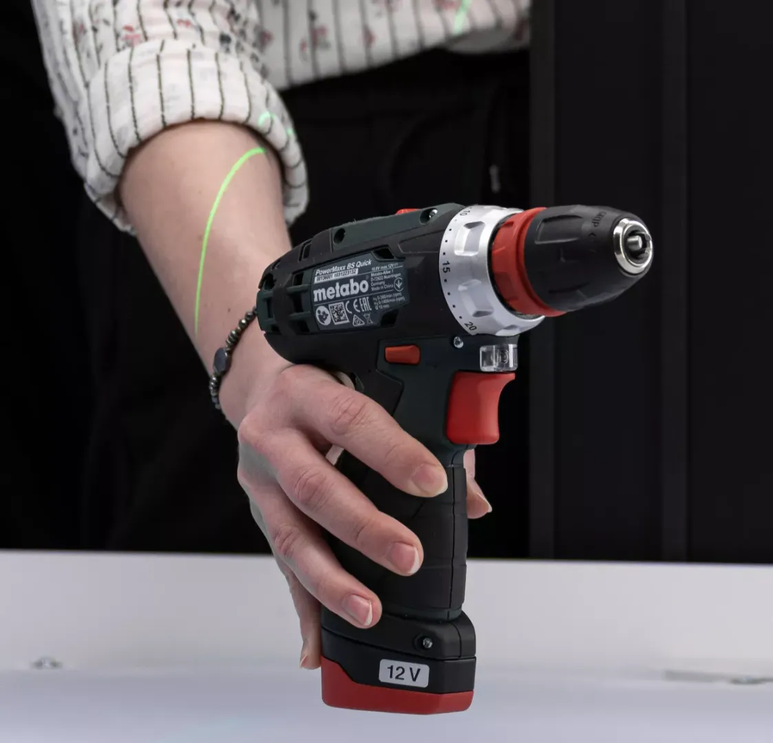 Close up of Metabo drill held by hand