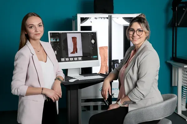 Two Women Photographers Reviewing Boot Product Shots