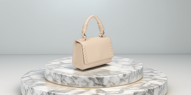 a creative photo of a handbag on a marble stand