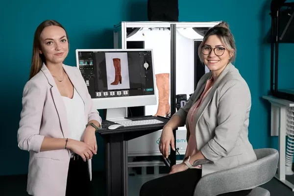 Two Women Photographers Reviewing Boot Product Shots