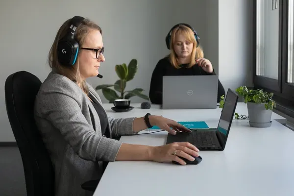 Two Customer Service Agents Working in Office Call Center