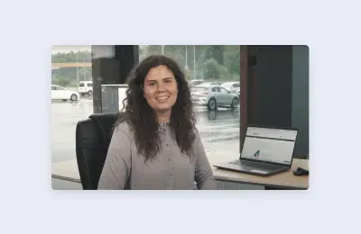 Smiling professional woman at office desk