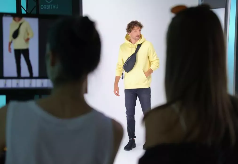 Model and Photographer Discussing Poses in Studio