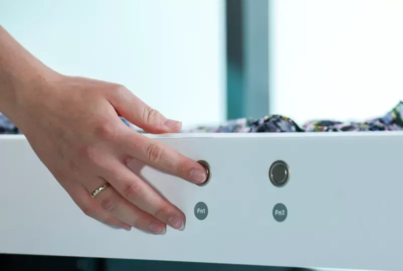 User Pressing Fn1 Function Button on Photo Studio Control Panel