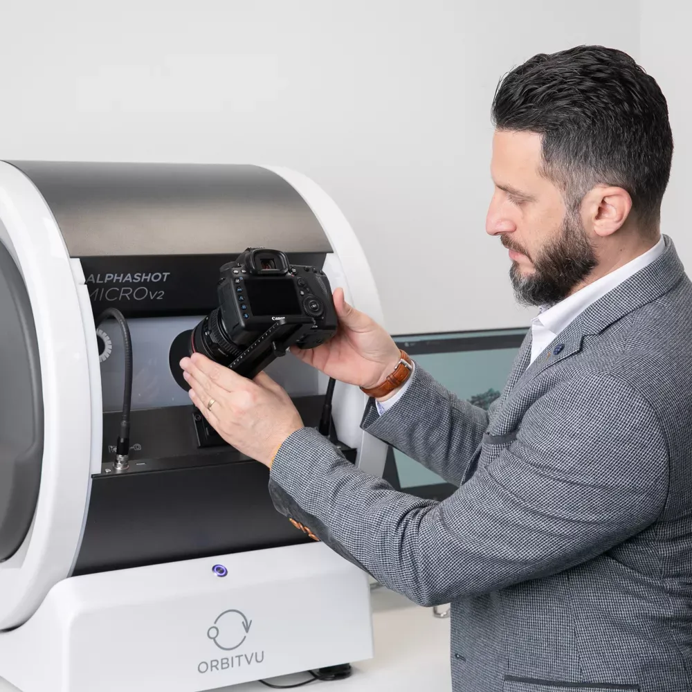 Man Attaching Camera to Orbitvu Alphashot Micro V2