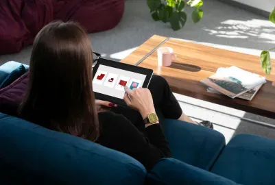 Woman Reviewing Furniture Product Images on Tablet