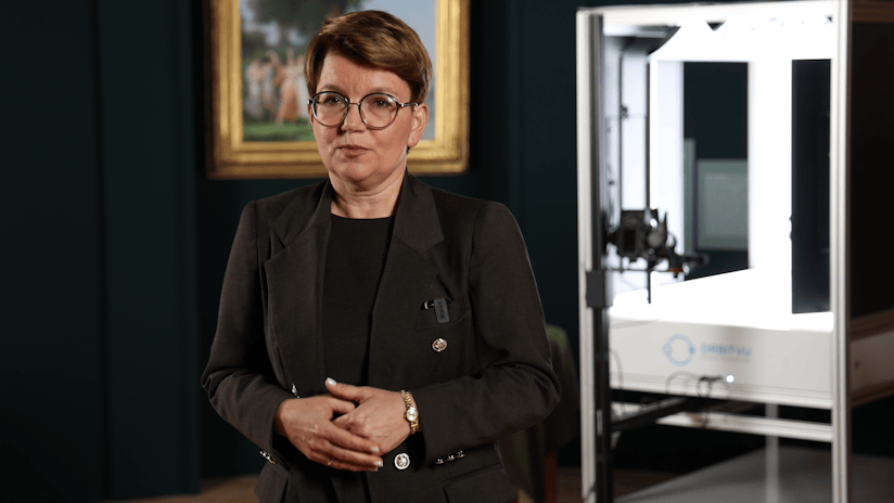 Woman in Blazer Next to Orbitvu Photography Equipment