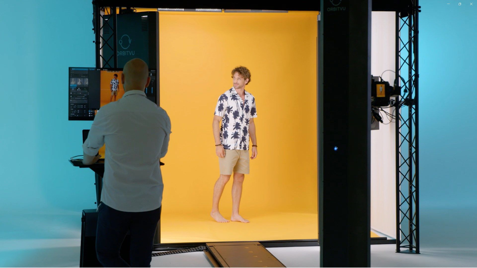 Male model in Hawaiian shirt posing on yellow background