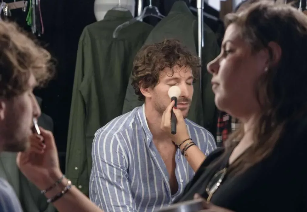 Male Model Receiving Makeup Application Before Photo Shoot