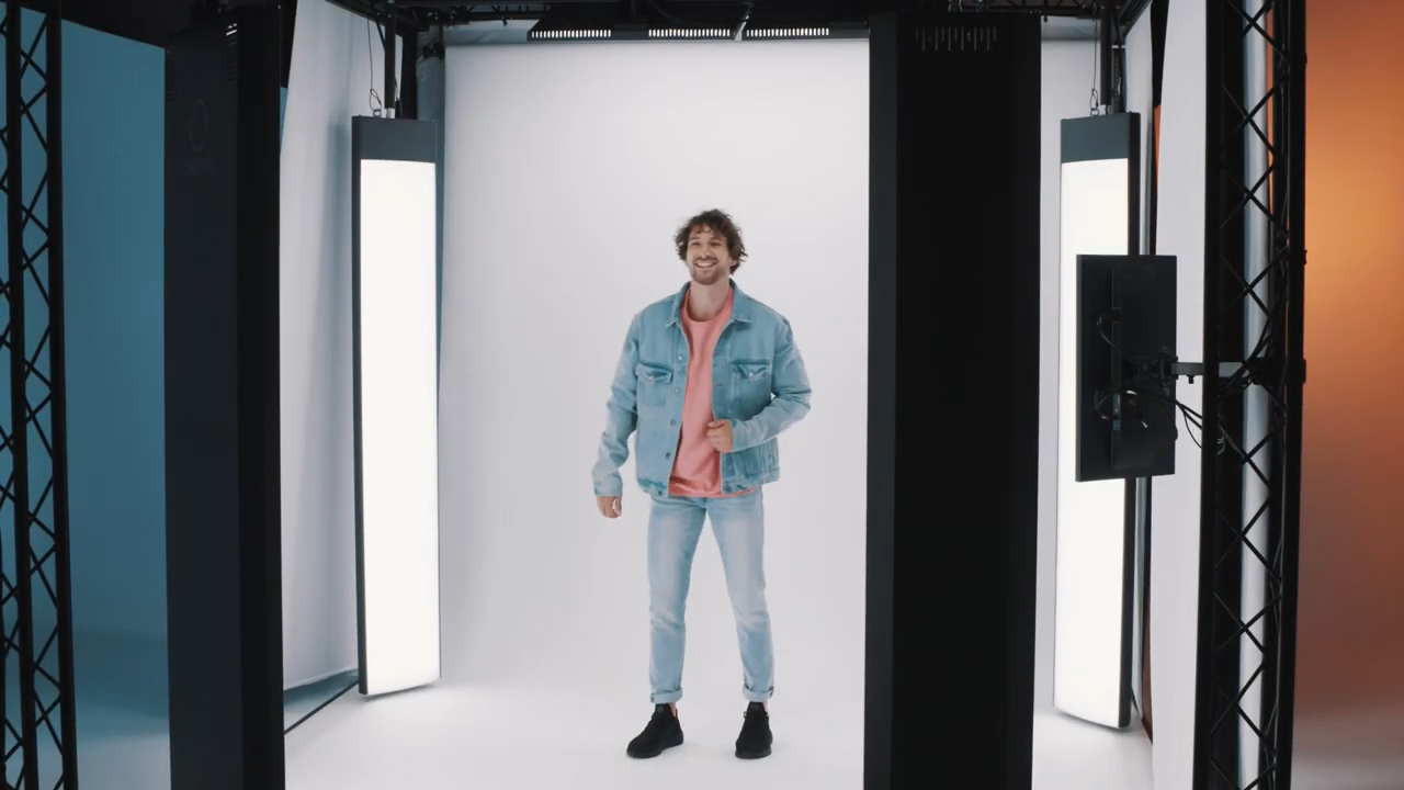Man in Denim Jacket and Light Jeans in Photo Studio