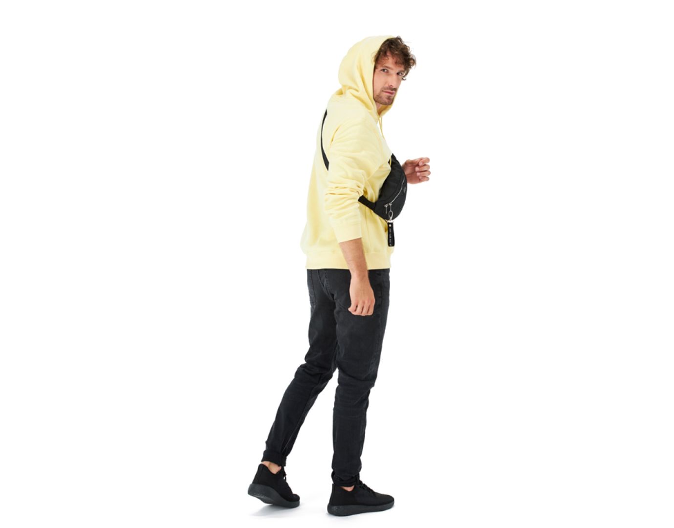 Man in Pale Yellow Hoodie and Black Jeans with Fanny Pack