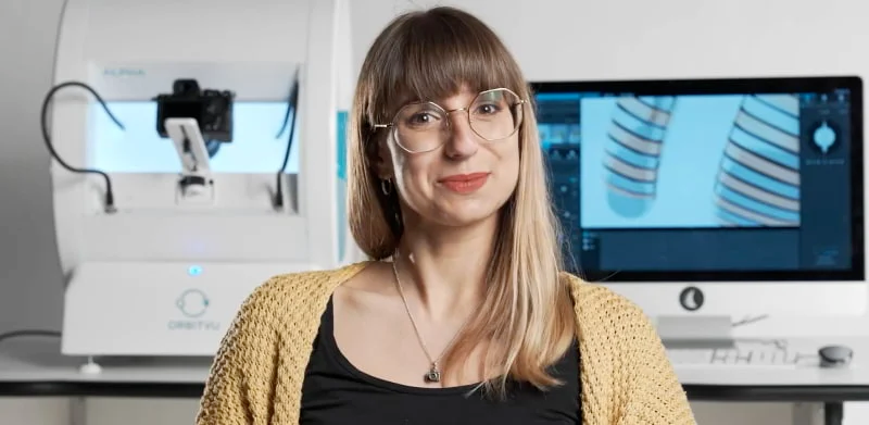 Woman Demonstrating Orbityu Product Photography Equipment