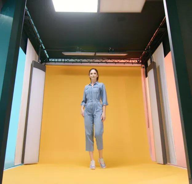 Full-Body Model Shot in Jeans Jumpsuit on Yellow Background