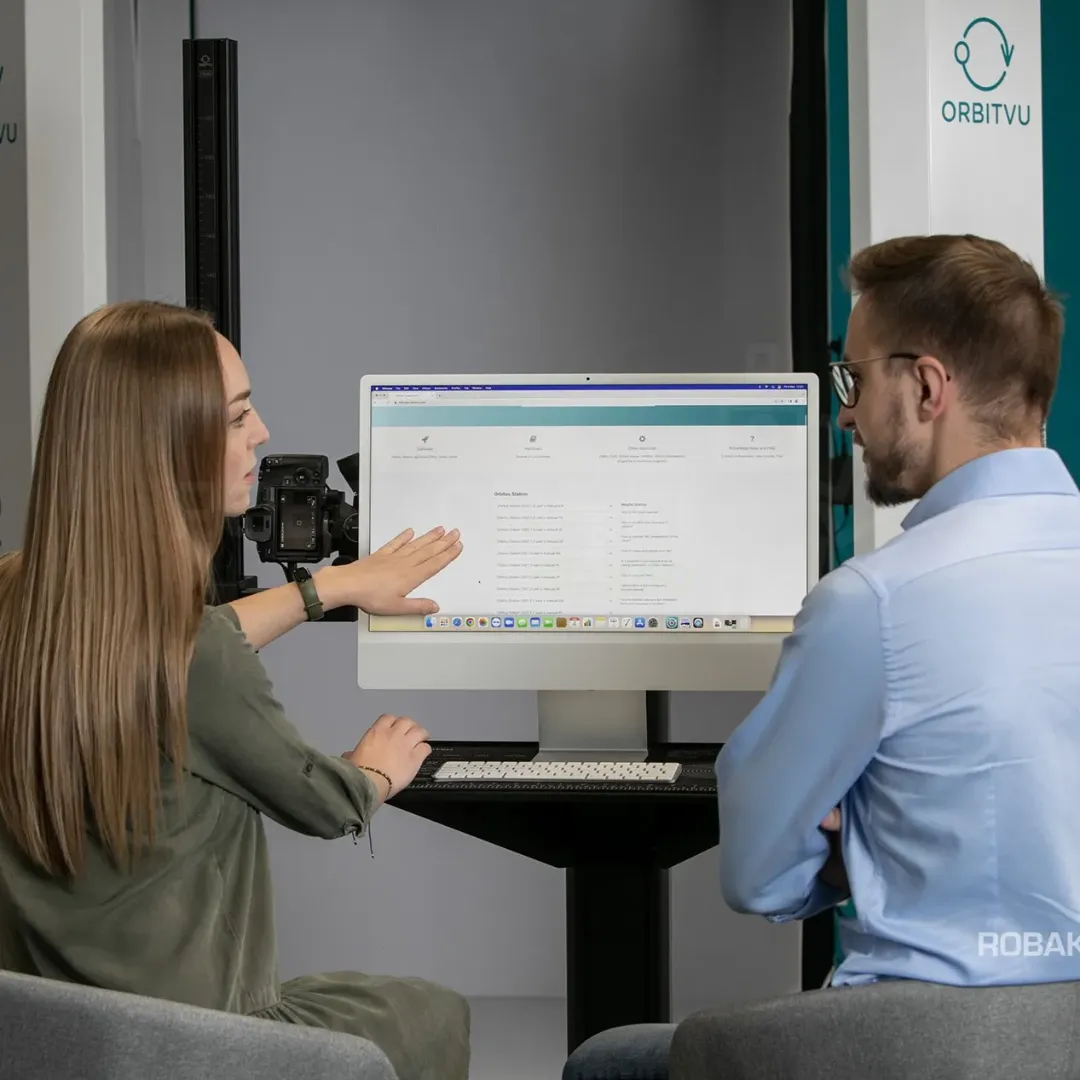 Two Colleagues Reviewing Software on Computer Monitor