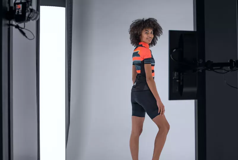 Female Cyclist Model Posing in Bright Studio