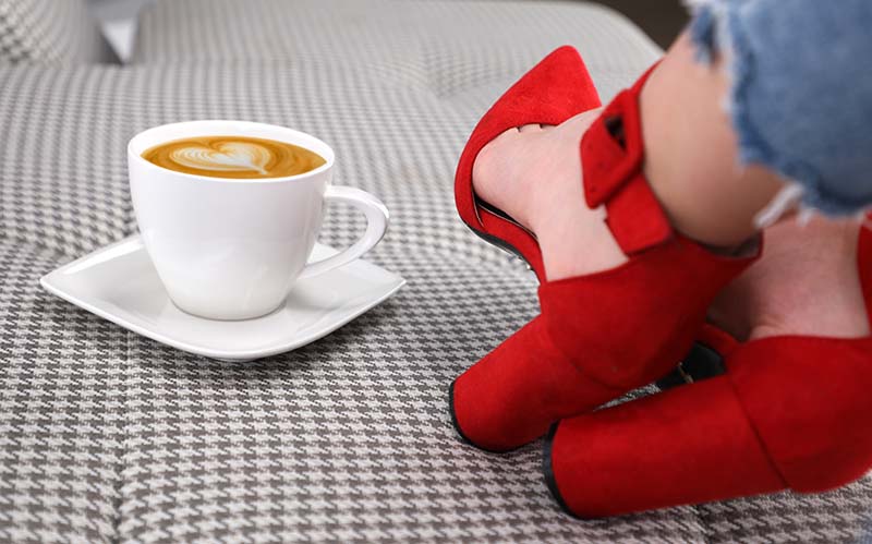Shofie with cappuccino and red shoes