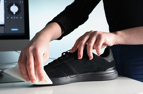 preparing a black shoe for a 360 product photo