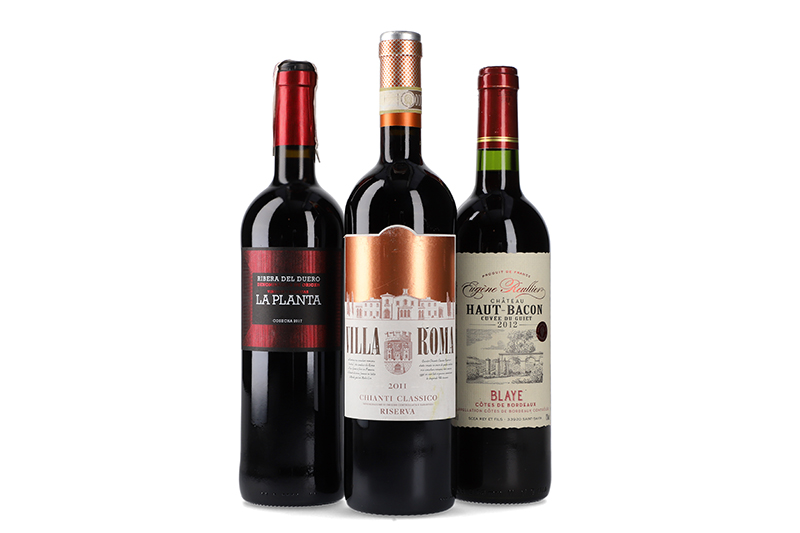 Three wine bottles on white background